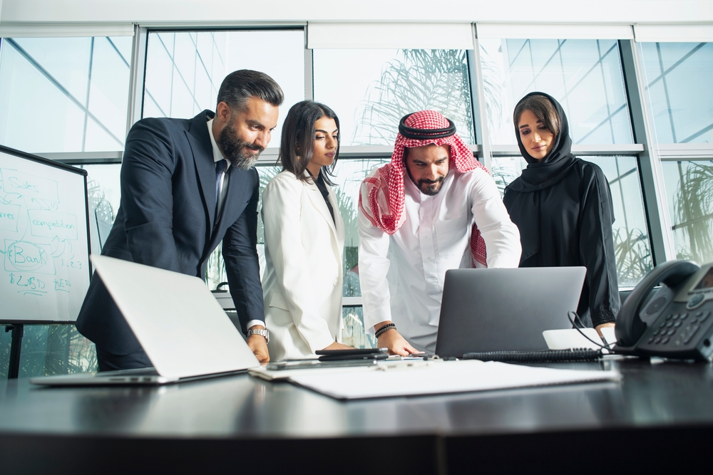 Multiethnic corporate business team meeting in the office for a strategic marketing plan - Office workers, entrepreneurs and company employee at work in a multinational company.