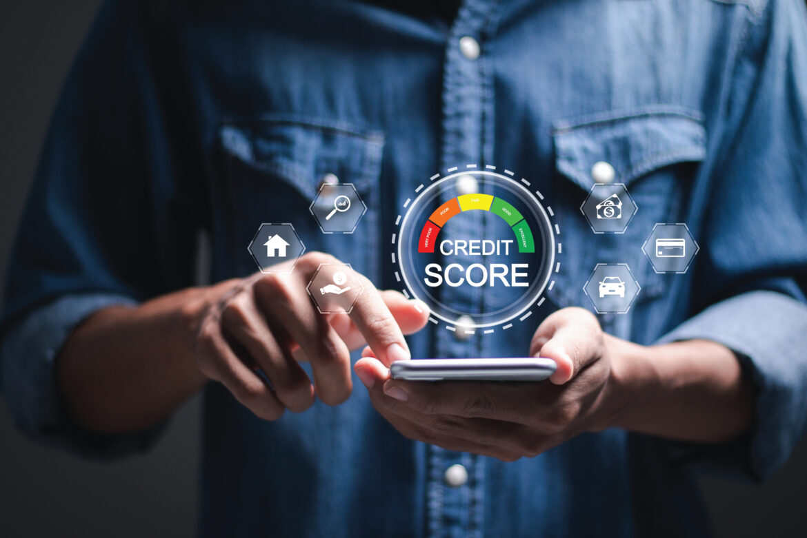 Men holding phone in hand checking his credit score