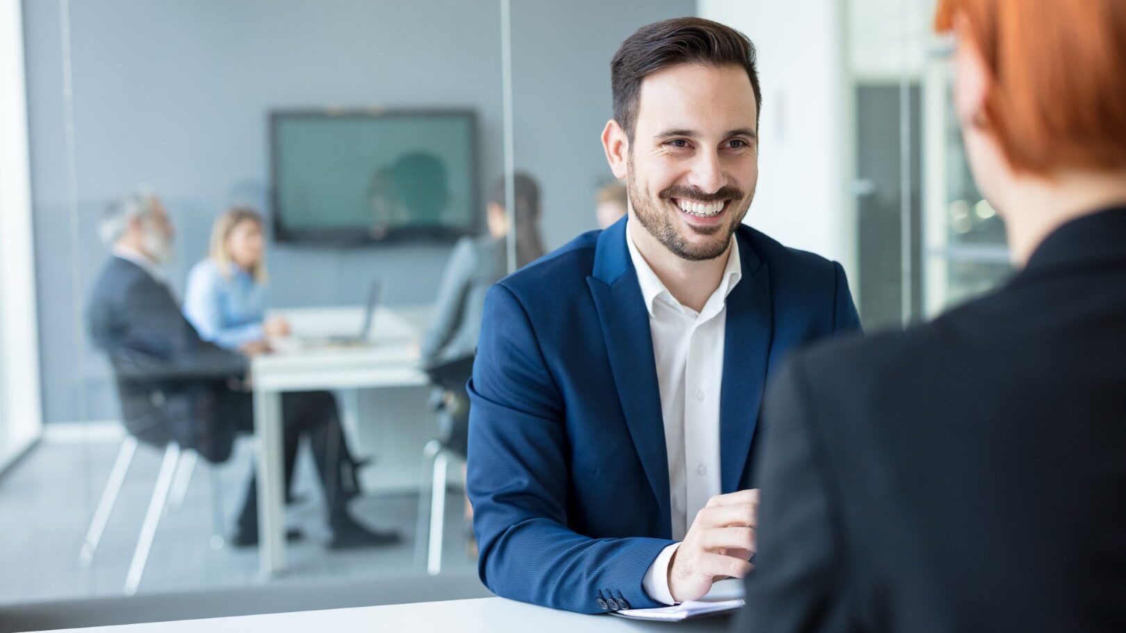 A young person having a conversation with finance advisor