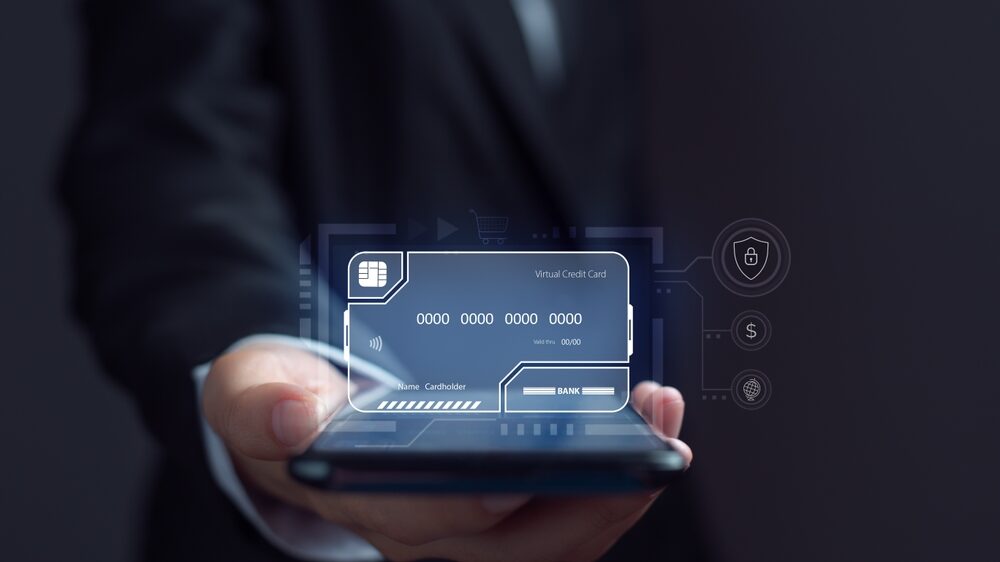 concept of Virtual credit card represented by a virtual credit card hovering over the smartphone in hand